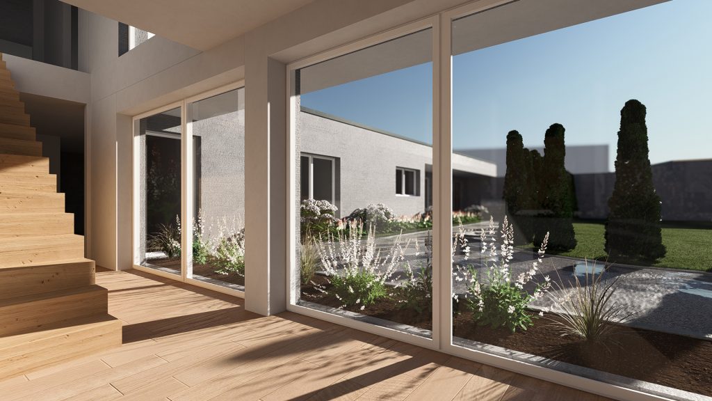 GERBERHAUS18 – Blick durch große bodentiefe Fenster in den modernen Innenhof mit Garten